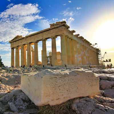 Greek ruins with a cloud filled sky"