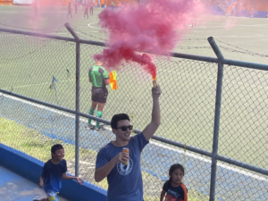 pink spray soccer game outside