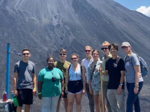 group students sunglasses volcano