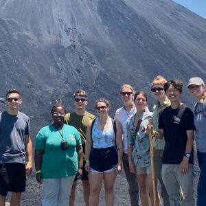 group students sunglasses volcano