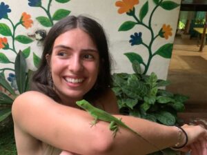 lizard on arm outside girl smile