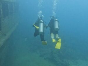Me holding hands with a girl on her first ever dive