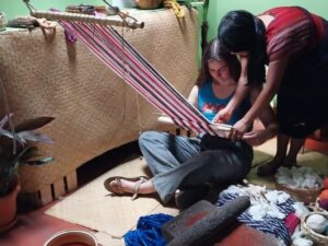 weaving girl guatemala floor