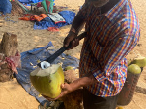 coconut opening man beach