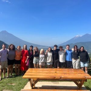 group photo of all central america students with mountain backdrop
