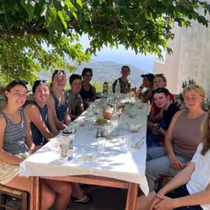 meraki students sitting down for dinner in crete