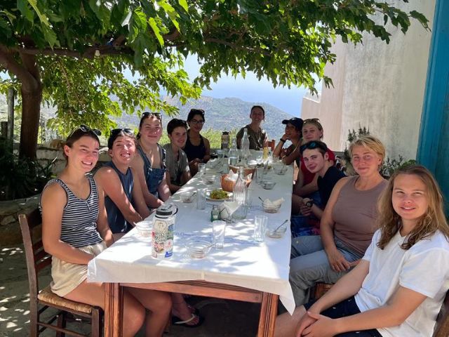 meraki students sitting down for dinner in crete