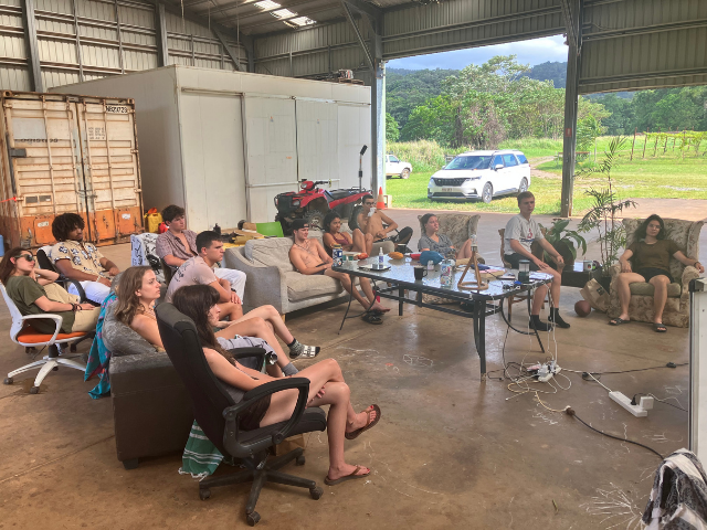 group of students relaxing in the hangar