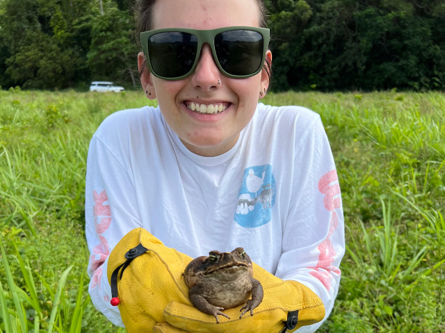 girl holding toad