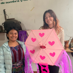 making heart craft with pink hearts kite