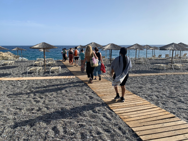walking along the beach on boardwalk in crete