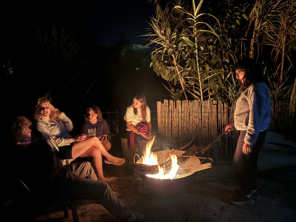 Students bonding around a bonfire