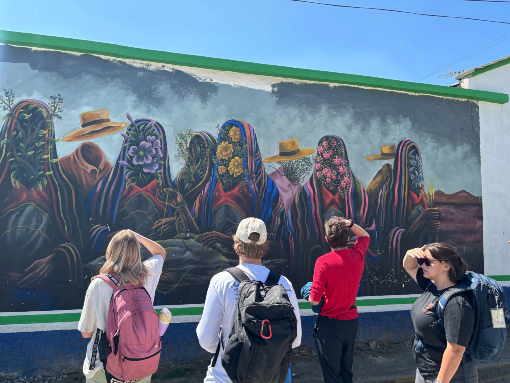 Students admiring wall mural