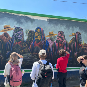 Students admiring wall mural